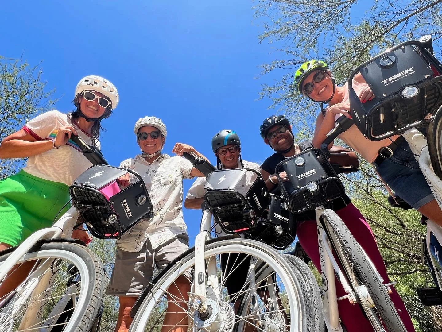 group of people with bike share bikes looking down on the camera