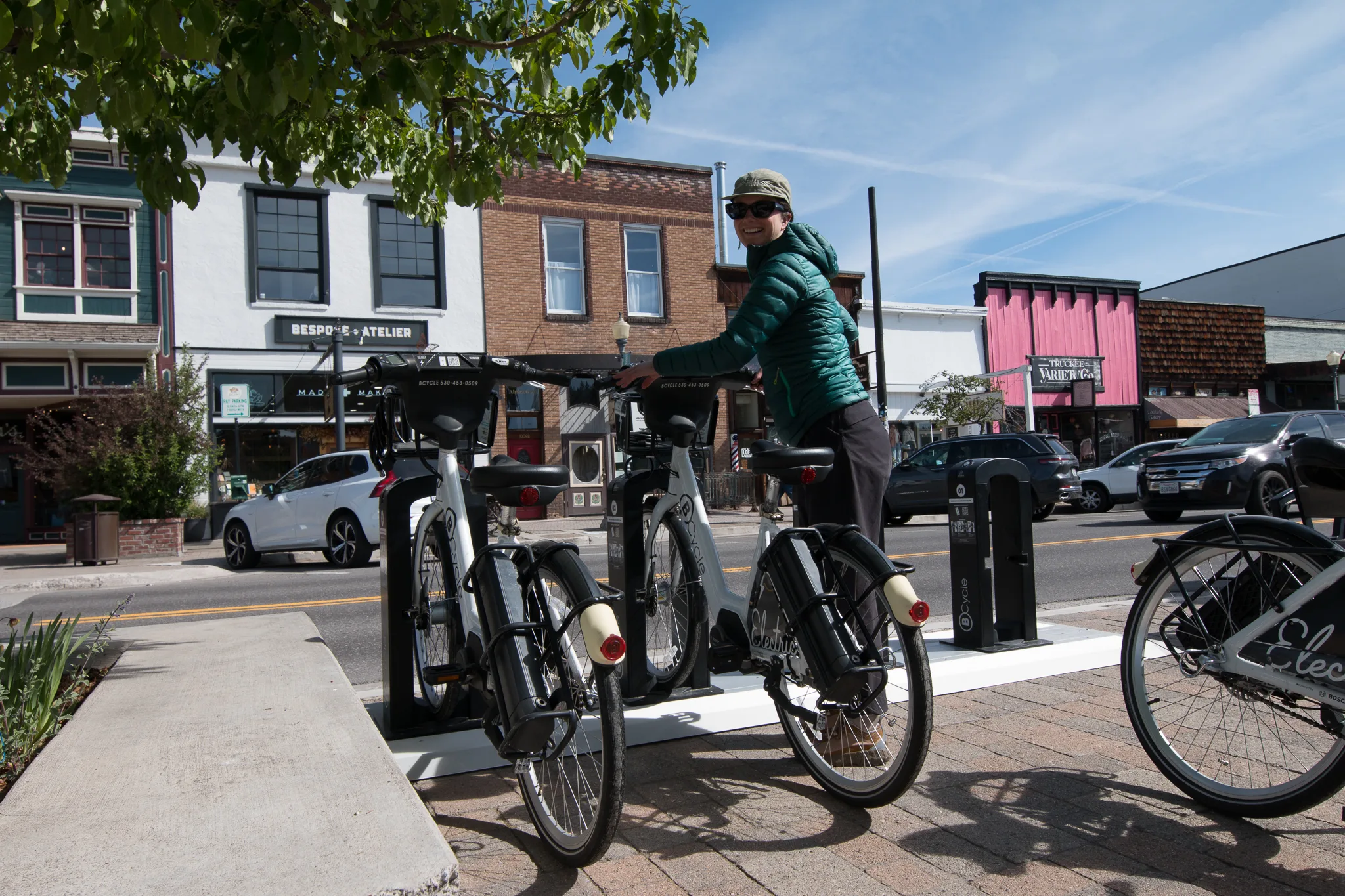woman docking her bike share bicycle